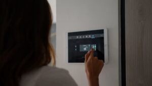 Woman using smart home security control